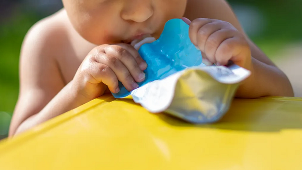 Eating pureed food in pouches doesn't teach babies how to chew or enjoy different types of textures, pediatricians say.  Maria Argutinskaya/iStockphoto/Getty Images